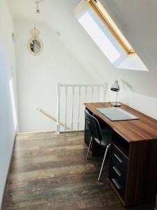 an office with a desk and a skylight at Maison de ville à Albert in Albert