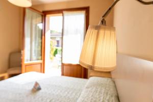 Postel nebo postele na pokoji v ubytování Villa Rosy