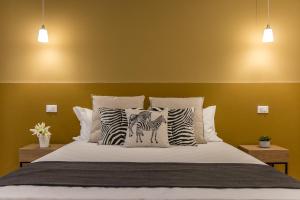 Posteľ alebo postele v izbe v ubytovaní Elegante appartamento da 6 Blu&Oro