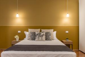 Posteľ alebo postele v izbe v ubytovaní Elegante appartamento da 6 Blu&Oro