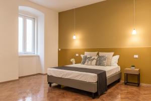Posteľ alebo postele v izbe v ubytovaní Elegante appartamento da 6 Blu&Oro