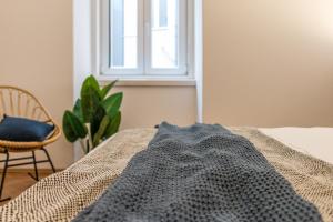 Posteľ alebo postele v izbe v ubytovaní Elegante appartamento da 6 Blu&Oro