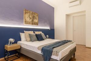 Posteľ alebo postele v izbe v ubytovaní Elegante appartamento da 6 Blu&Oro