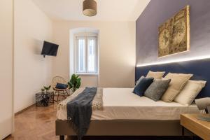 Televízia a/alebo spoločenská miestnosť v ubytovaní Elegante appartamento da 6 Blu&Oro