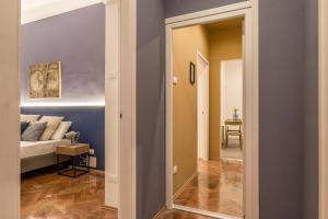 Posteľ alebo postele v izbe v ubytovaní Elegante appartamento da 6 Blu&Oro