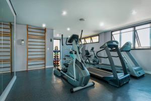 a gym with two tread machines in a room at Radisson Oscar Freire in Sao Paulo