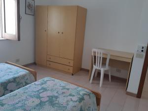 Postel nebo postele na pokoji v ubytování Baia Unci