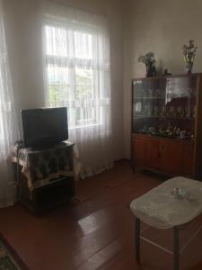 TV a/nebo společenská místnost v ubytování House Dea Dea