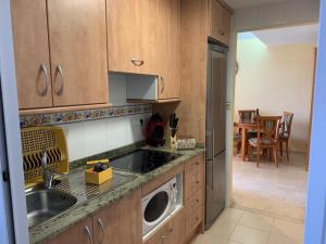 Kuchyň nebo kuchyňský kout v ubytování GEMELO 23 APARTMENT BEACH LEVANTE