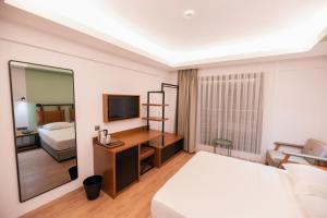 A bed or beds in a room at La Farine Rooms