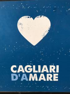 a white heart with the words carolandan manage at Cagliari d'Amare Via Roma in Cagliari