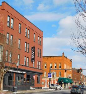a brick building on the corner of a street at The Gould Hotel in Seneca Falls