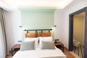 A bed or beds in a room at La Farine Rooms