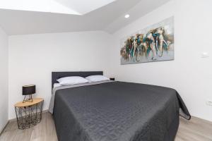 Postel nebo postele na pokoji v ubytování Sun Apartment Klis