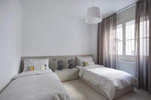 Posteľ alebo postele v izbe v ubytovaní C-Apartment Zabarella terrace
