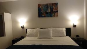 Postel nebo postele na pokoji v ubytování Hotel MB