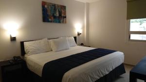 Postel nebo postele na pokoji v ubytování Hotel MB