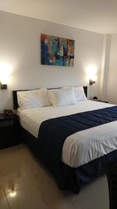 Postel nebo postele na pokoji v ubytování Hotel MB