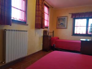 سرير أو أسرّة في غرفة في Tenuta Litiano