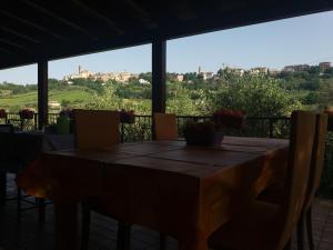 a table and chairs on a balcony with a view at B&B Land & Sea in Campofilone +45 photos
