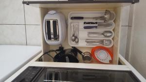 a drawer filled with utensils in a kitchen at Aeolos Hotel Apartments in Gythio