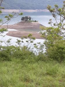 an island in the middle of a body of water at mobil home paradisiaque in Crots