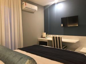 Postel nebo postele na pokoji v ubytování Hotel Bossa Nova Cabo Frio