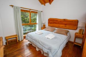Postel nebo postele na pokoji v ubytování Cabañas Villa Sequoia