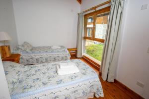 Postel nebo postele na pokoji v ubytování Cabañas Villa Sequoia