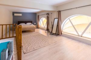 Postel nebo postele na pokoji v ubytování Mon-Repo Suites
