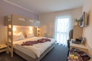 Postel nebo postele na pokoji v ubytování Topmotel