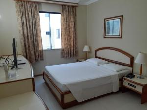 Postel nebo postele na pokoji v ubytování Hotel Sagres