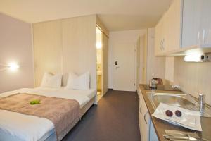 Postel nebo postele na pokoji v ubytování Topmotel