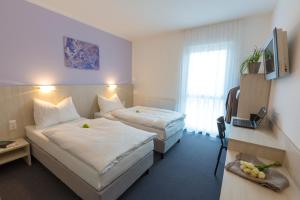 Postel nebo postele na pokoji v ubytování Topmotel