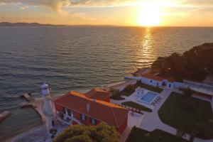 an aerial view of a house with a lighthouse at Puntamika Laterna in Zadar