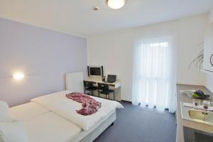 Postel nebo postele na pokoji v ubytování Topmotel