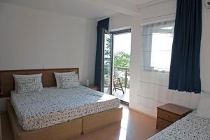 Säng eller sängar i ett rum på Villa Pavlina