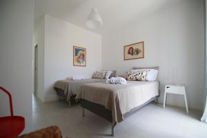 Llit o llits en una habitació de Villa Martorana, Camere e Appartamenti Short Let's