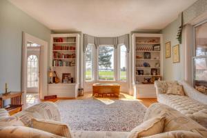 a living room with a couch and a table at Our Space the Perfect Place B&B in Picton