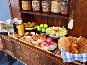 a buffet with different types of food on a table at Aberllynfi Riverside Guest House in Glasbury