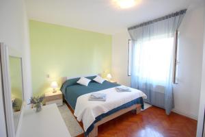 A bed or beds in a room at Apartment Agnese