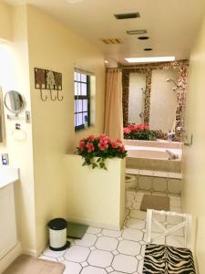 a bathroom with a tub and a toilet and a sink at VILLA BELLY in Naples in Naples