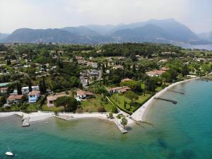 an aerial view of a island in the water at Lamasu RioVerde - Lago di Garda in San Felice del Benaco