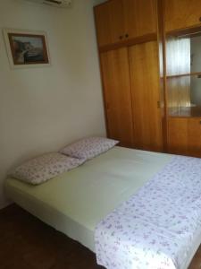 Postel nebo postele na pokoji v ubytování Apartmani Ujdur