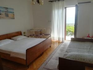 Postel nebo postele na pokoji v ubytování Apartmani Ujdur