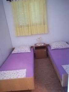 Postel nebo postele na pokoji v ubytování Apartmani Ujdur
