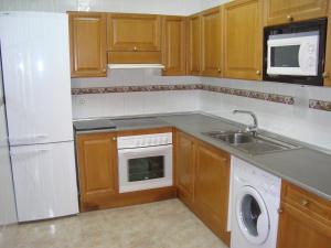 A kitchen or kitchenette at Apartamentos Saila