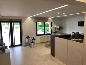 an office with a reception desk in a room at Hotel Florida in A Lanzada