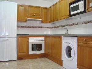 A kitchen or kitchenette at Apartamentos Saila