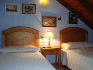 A bed or beds in a room at Apartamentos Saila